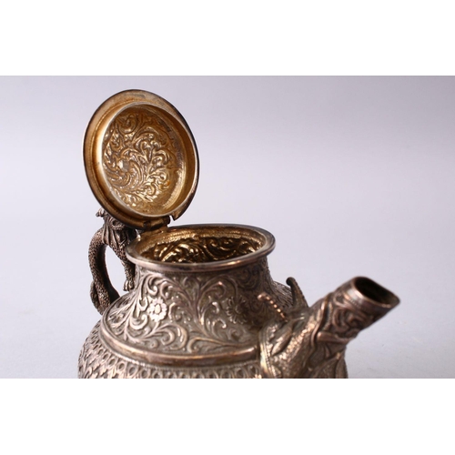 839 - A GOOD 19TH CENTURY TURKISH SOLID SILVER TEAPOT  carved with formal foliage and a dog style handle, ... 