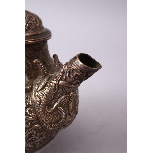 839 - A GOOD 19TH CENTURY TURKISH SOLID SILVER TEAPOT  carved with formal foliage and a dog style handle, ... 