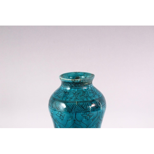 845 - A 19TH CENTURY ISLAMIC MARKET DRUG JAR, with turquoise glazed decoration, 20cm high.