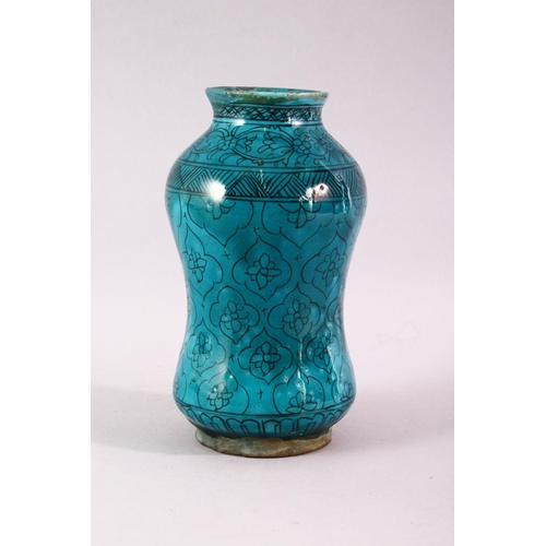 845 - A 19TH CENTURY ISLAMIC MARKET DRUG JAR, with turquoise glazed decoration, 20cm high.