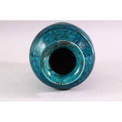 845 - A 19TH CENTURY ISLAMIC MARKET DRUG JAR, with turquoise glazed decoration, 20cm high.