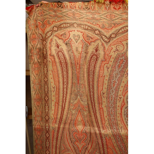 851 - A LARGE PAISLEY BED COVER OR THROW, of typical form, 320cm x 155cm.