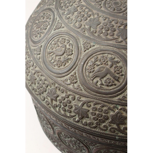 855 - A 19TH CENTURY INDIAN EMBOSSED COPPER BOWL AND COVER, the vessel with embossed decoration with round... 