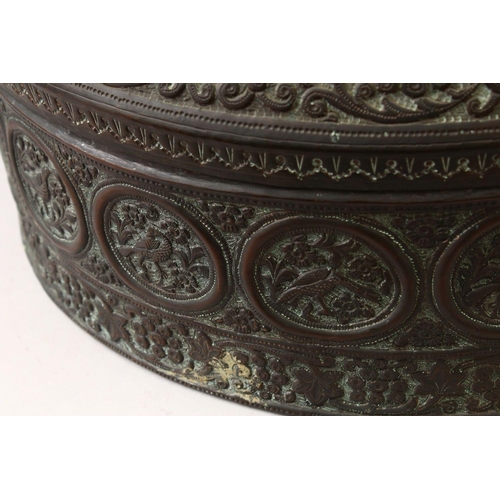 855 - A 19TH CENTURY INDIAN EMBOSSED COPPER BOWL AND COVER, the vessel with embossed decoration with round... 