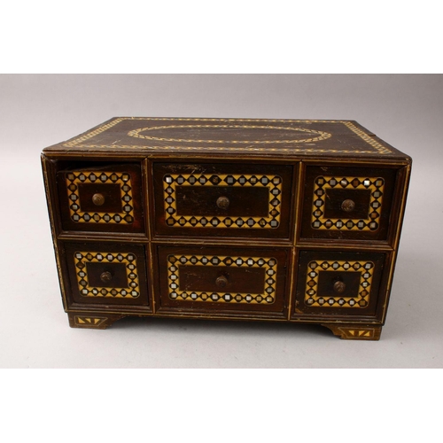 862 - A GOOD 19TH CENTURY INDIAN WOODEN BOX, with six drawers and band of inlaid mother of pearl, 34cm wid... 