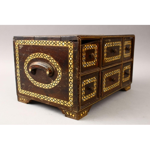 862 - A GOOD 19TH CENTURY INDIAN WOODEN BOX, with six drawers and band of inlaid mother of pearl, 34cm wid... 