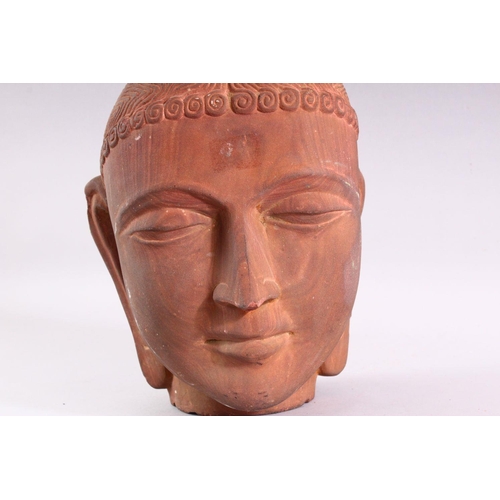 863 - A GOOD HEAVY CARVED STONE BUST of an Indian female, 28cm high.