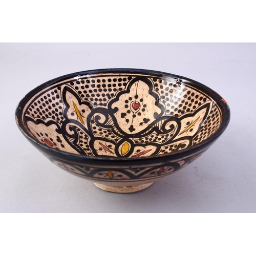 867 - A GOOD ISLAMIC SIGNED POTTERY BOWL - SAFI, the interior decorated with formal floral design, the bas... 