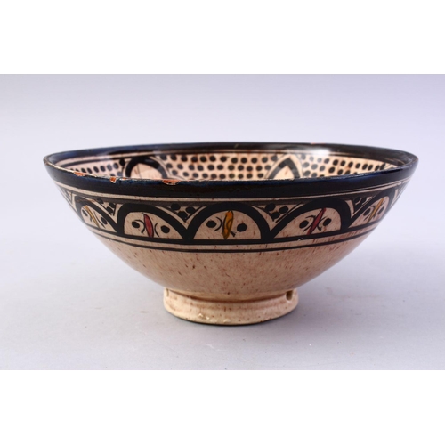 867 - A GOOD ISLAMIC SIGNED POTTERY BOWL - SAFI, the interior decorated with formal floral design, the bas... 