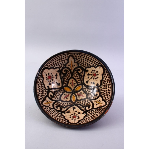 867 - A GOOD ISLAMIC SIGNED POTTERY BOWL - SAFI, the interior decorated with formal floral design, the bas... 