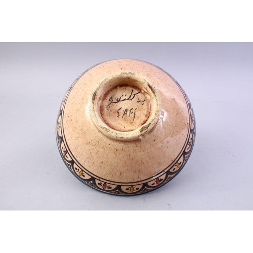 867 - A GOOD ISLAMIC SIGNED POTTERY BOWL - SAFI, the interior decorated with formal floral design, the bas... 