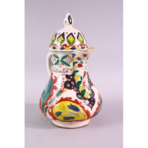 875 - A 19TH CENTURY TURKISH KUTAHYA WATER JUG AND COVER, overall height 20cm.