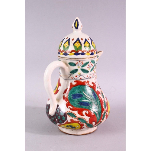 875 - A 19TH CENTURY TURKISH KUTAHYA WATER JUG AND COVER, overall height 20cm.