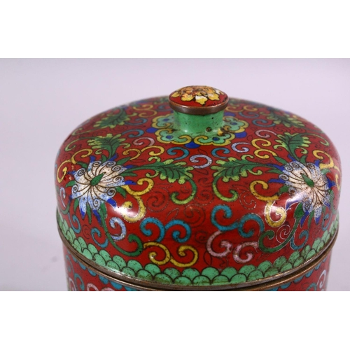 88 - A 19TH / 20TH CENTURY CHINESE CLOISONNE CYLINDRICAL BOX AND COVER, decorated upon a red ground with ... 