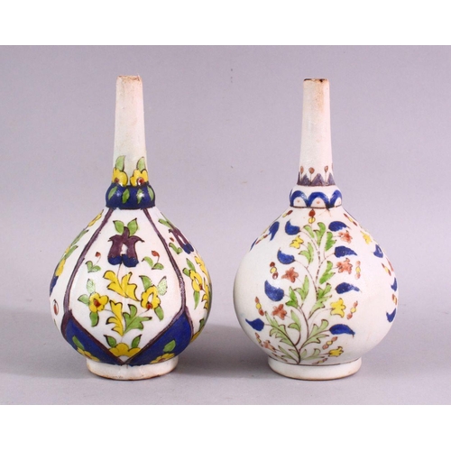 880 - TWO ISLAMIC FLORAL DECORATED ROSEWATER SPRINKLERS, 15cm high.