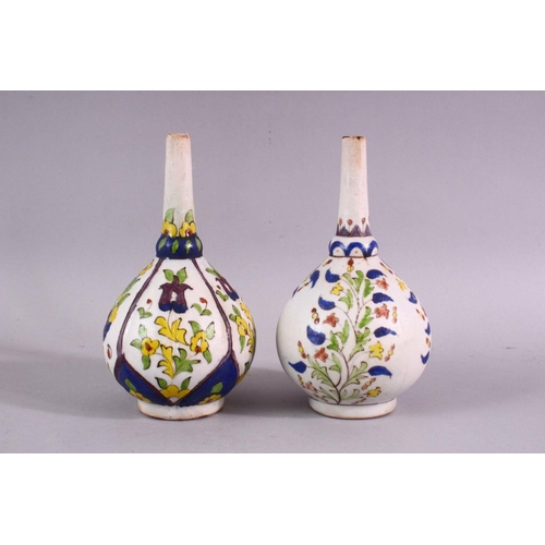 880 - TWO ISLAMIC FLORAL DECORATED ROSEWATER SPRINKLERS, 15cm high.