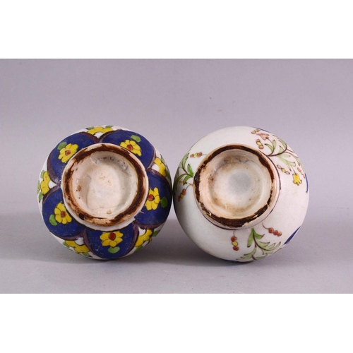 880 - TWO ISLAMIC FLORAL DECORATED ROSEWATER SPRINKLERS, 15cm high.