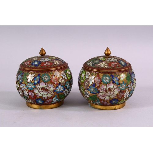 89 - A PAIR OF CHINESE CLOISONNE LIDDED JARS, each decorated with raised floral decoration, 9cm high x 8c... 