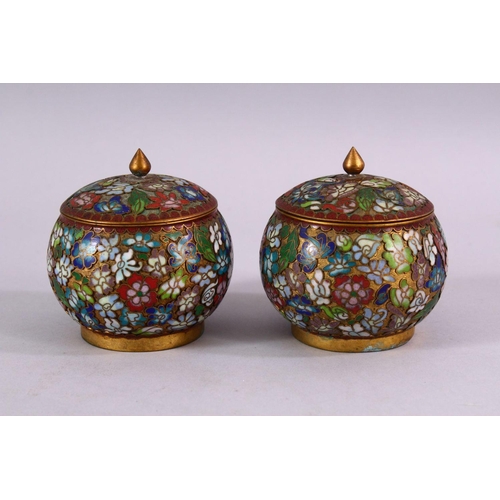 89 - A PAIR OF CHINESE CLOISONNE LIDDED JARS, each decorated with raised floral decoration, 9cm high x 8c... 