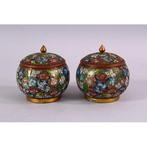 89 - A PAIR OF CHINESE CLOISONNE LIDDED JARS, each decorated with raised floral decoration, 9cm high x 8c... 