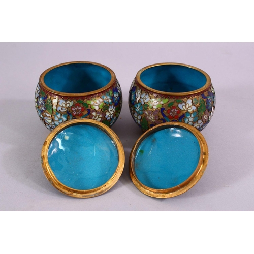 89 - A PAIR OF CHINESE CLOISONNE LIDDED JARS, each decorated with raised floral decoration, 9cm high x 8c... 