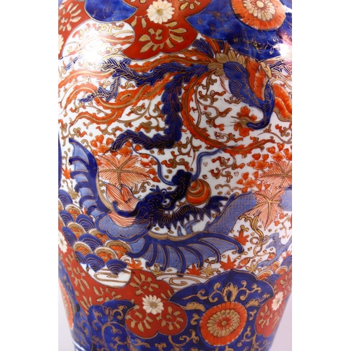 9 - A LARGE JAPANESE MEIJI PERIOD IMARI PORCELAIN VASE, decorated with views of a dragon and phoenix amo... 