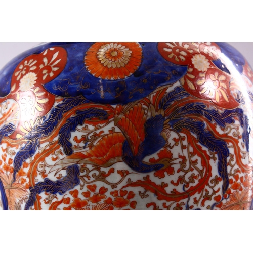 9 - A LARGE JAPANESE MEIJI PERIOD IMARI PORCELAIN VASE, decorated with views of a dragon and phoenix amo... 