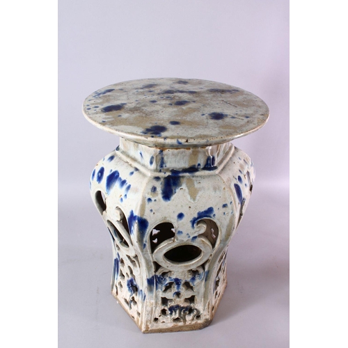 95 - A 18TH / 19TH CENTURY CHINESE BLUE SPLASH GLAZED POTTERY GARDEN SEAT, with openwor sides with bats, ... 