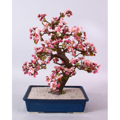 96 - A JAPANESE CARVED HARD STONE FIGURE OF A BONSAI, depicting a cherry blossom tree, 42cm high x 25cm w... 