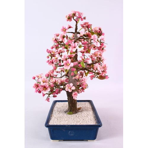 96 - A JAPANESE CARVED HARD STONE FIGURE OF A BONSAI, depicting a cherry blossom tree, 42cm high x 25cm w... 