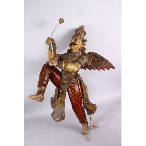 825 - A 19TH CENTURY INDIAN / BURMESE CARVED WOOD FIGURE OF A WINGED GOD, stood holding an implement, with... 