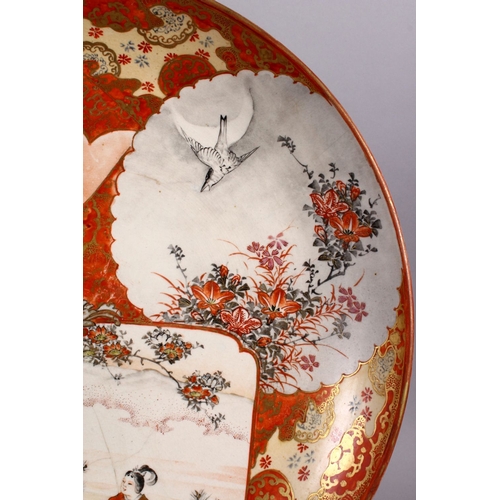 125 - A JAPANESE MEIJI PERIOD KUTANI PORCELAIN CHARGER, with decoration of figures exterior, birds amongst... 