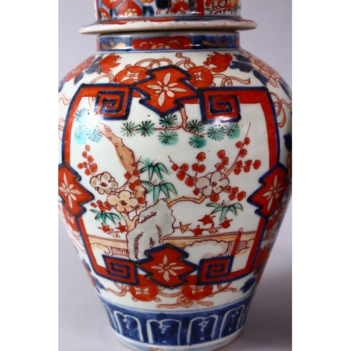 1 - A PAIR OF MEIJI PERIOD IMARI VASES AND COVERS, with kylin finials, overall 30cm high.