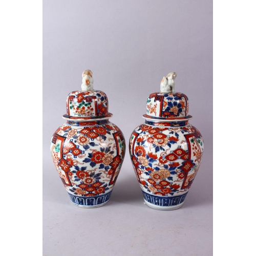 1 - A PAIR OF MEIJI PERIOD IMARI VASES AND COVERS, with kylin finials, overall 30cm high.