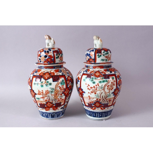 1 - A PAIR OF MEIJI PERIOD IMARI VASES AND COVERS, with kylin finials, overall 30cm high.