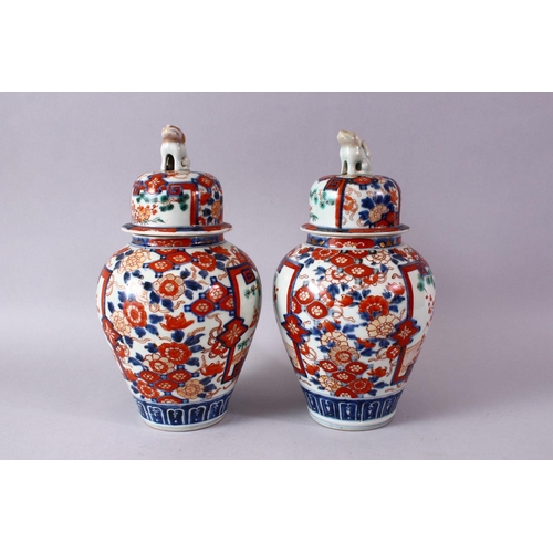 1 - A PAIR OF MEIJI PERIOD IMARI VASES AND COVERS, with kylin finials, overall 30cm high.