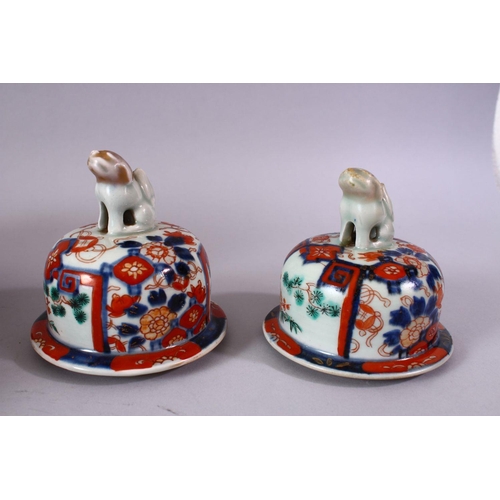 1 - A PAIR OF MEIJI PERIOD IMARI VASES AND COVERS, with kylin finials, overall 30cm high.