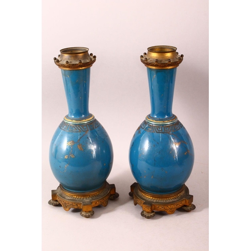 106 - A PAIR OF 19TH CENTURY CHINESE PORCELAIN BOTTLE VASES / LAMP BASES, the ground with gilded decoratio... 