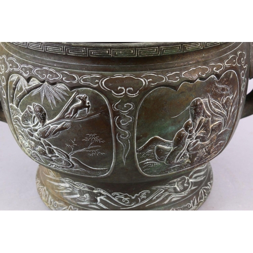 109 - A 19TH CENTURY CHINESE BRONZE IMMORTAL TWIN HANDLED CENSER, with carved panel decoration depicting i... 