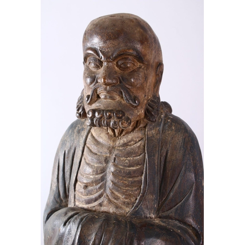 11 - A 18TH/19TH CENTURY CHINESE CARVED WOOD FIGURE OF ROHAN, on a shaped base, 90cm high.