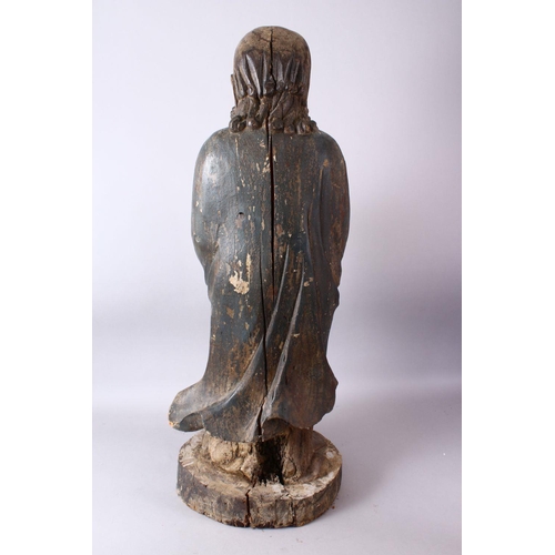 11 - A 18TH/19TH CENTURY CHINESE CARVED WOOD FIGURE OF ROHAN, on a shaped base, 90cm high.