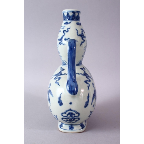 111 - A CHINESE MING STYLE BLUE & WHITE PORCELAIN MOON FLASK, decorated with scenes of phoenix birds among... 