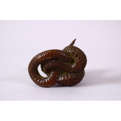 119 - A JAPANESE BRONZE MODEL OF A COBRA SNAKE, intertwined, signed, 4.5cm.