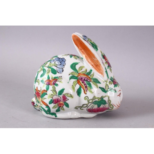 126 - A 20TH CENTURY FAMILLE ROSE PORCELAIN HARE, painted with peach tree decoration, 12cm long.