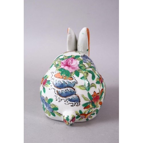 126 - A 20TH CENTURY FAMILLE ROSE PORCELAIN HARE, painted with peach tree decoration, 12cm long.