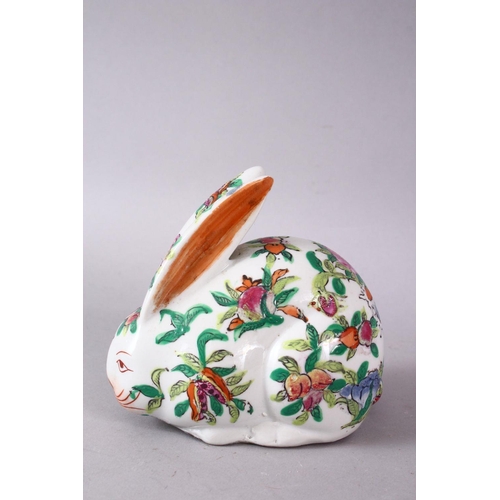 126 - A 20TH CENTURY FAMILLE ROSE PORCELAIN HARE, painted with peach tree decoration, 12cm long.