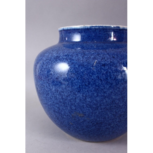 130 - A 19TH CENTURY CHINESE POTTERY BULBOUS VASE, decorated with a mottled blue glaze, 21cm high.