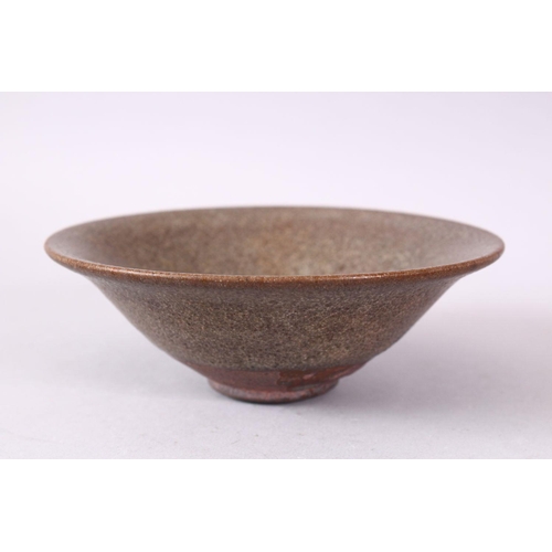 132 - A CHINESE CIRCULAR TEA BOWL, with brown textured glaze, 13.5cm.