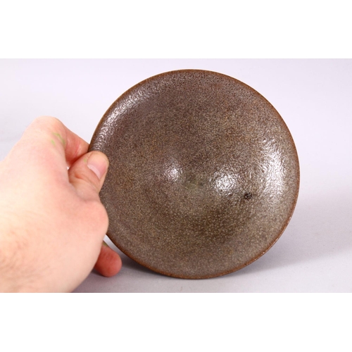 132 - A CHINESE CIRCULAR TEA BOWL, with brown textured glaze, 13.5cm.