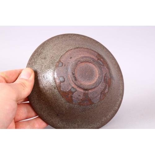 132 - A CHINESE CIRCULAR TEA BOWL, with brown textured glaze, 13.5cm.